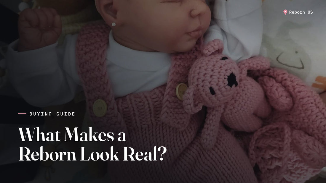 Hand painted reborn doll sleeping in a knitted pink romper with a cream bow, showing realistic skin tones and details